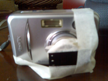 Image of over-exposed film taped to the front of a camera